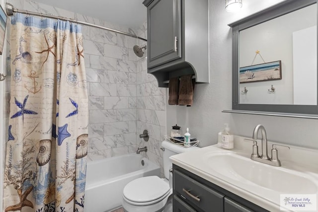 full bath featuring vanity, shower / bathtub combination with curtain, and toilet