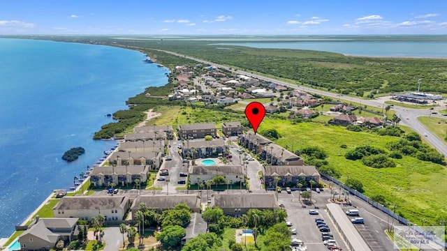 bird's eye view with a water view and a residential view