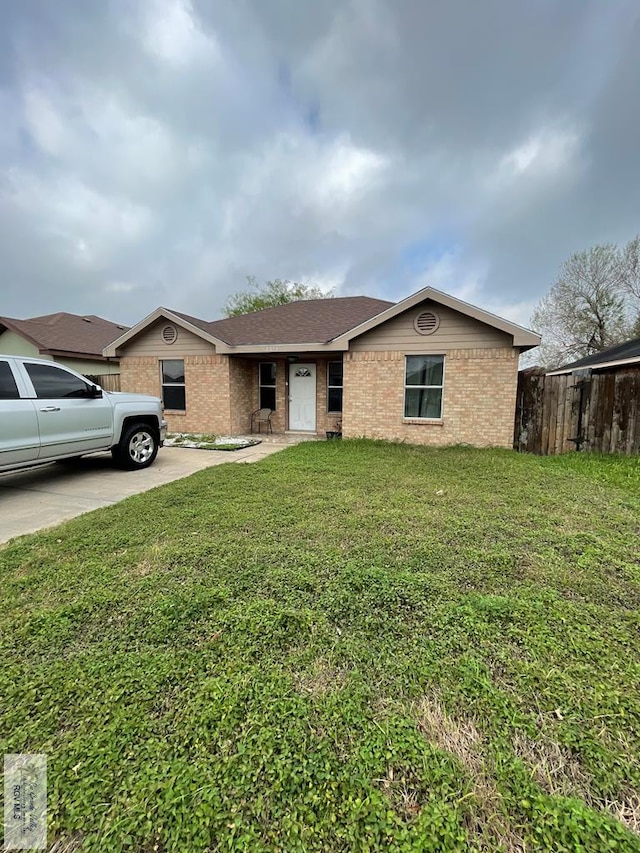 ranch-style house with a front lawn