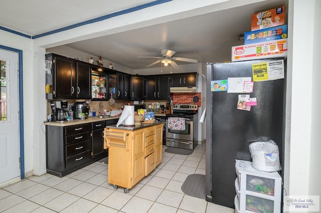 307 W Boone Ave, Pharr, TX 78577 - kitchen featuring appliances with stainless steel finishes, under cabinet range hood, light tile patterned floors, ceiling fan, and a center island