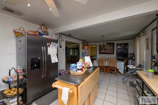 307 W Boone Ave, Pharr, TX 78577 - kitchen with stainless steel fridge, light tile patterned floors, and a ceiling fan