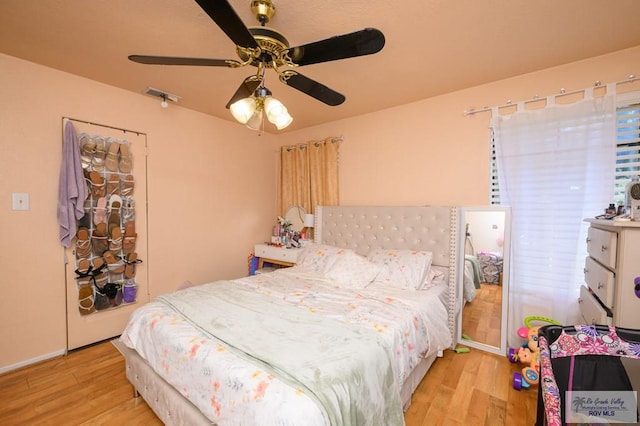 307 W Boone Ave, Pharr, TX 78577 - bedroom with wood finished floors and ceiling fan