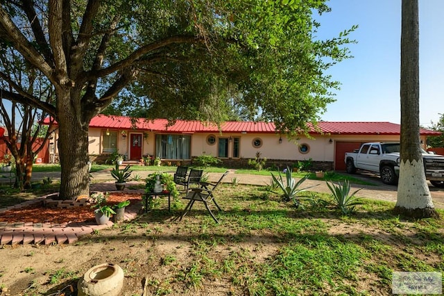 307 W Boone Ave, Pharr, TX 78577 - single story home featuring an attached garage, a metal roof, and concrete driveway