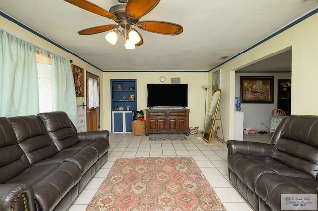 307 W Boone Ave, Pharr, TX 78577 - living room with light tile patterned floors, ceiling fan, and built in features