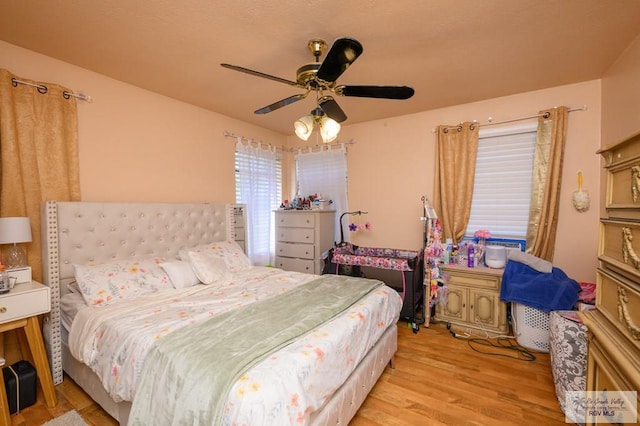 307 W Boone Ave, Pharr, TX 78577 - bedroom with light wood-type flooring and a ceiling fan
