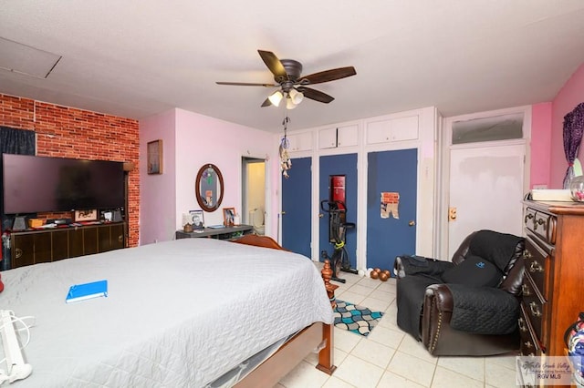 307 W Boone Ave, Pharr, TX 78577 - bedroom featuring light tile patterned floors, ceiling fan, and brick wall