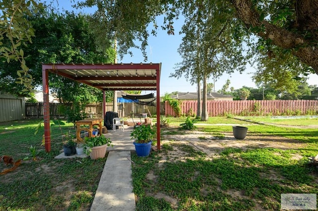 307 W Boone Ave, Pharr, TX 78577 - fenced backyard with a patio