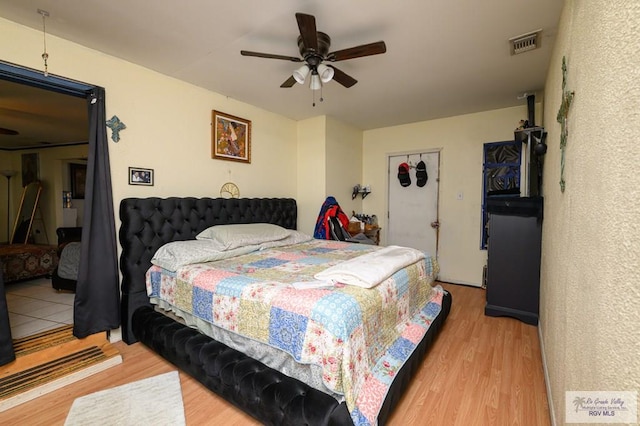 307 W Boone Ave, Pharr, TX 78577 - bedroom with light wood-style flooring and ceiling fan