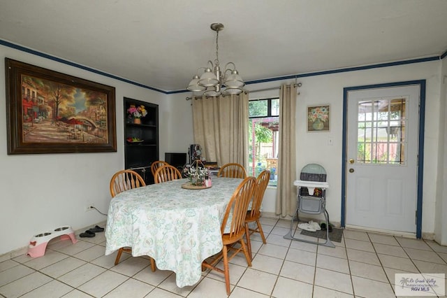307 W Boone Ave, Pharr, TX 78577 - dining room with a chandelier, light tile patterned floors, and ornamental molding