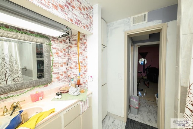 307 W Boone Ave, Pharr, TX 78577 - bathroom featuring marble look tile flooring and vanity