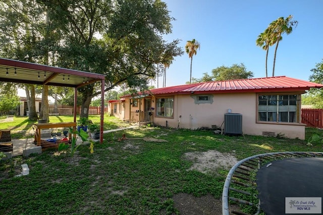 307 W Boone Ave, Pharr, TX 78577 - back of property featuring a metal roof and stucco siding