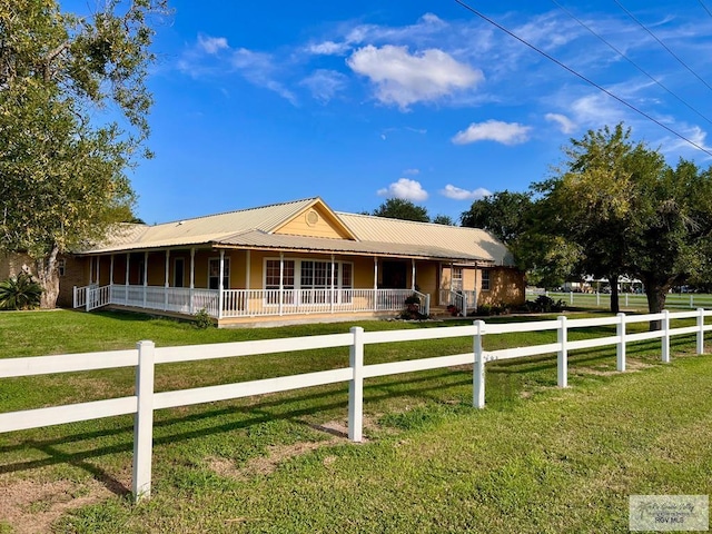 view of front of property with a porch and a front lawn