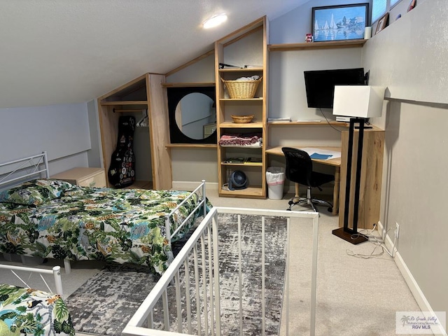 carpeted bedroom featuring vaulted ceiling