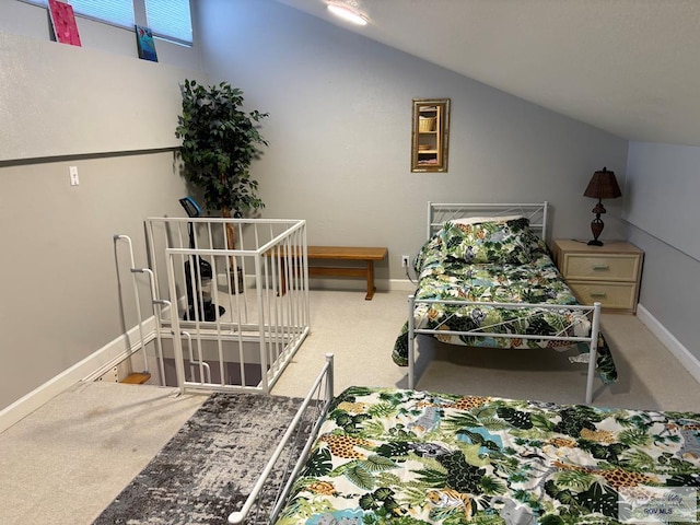 carpeted bedroom featuring vaulted ceiling