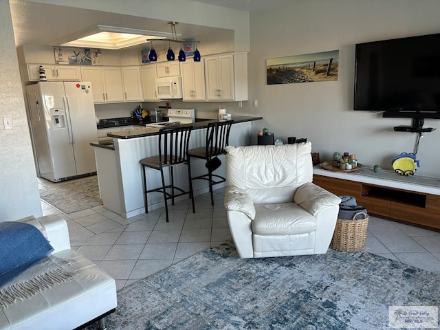 living room featuring light tile patterned flooring