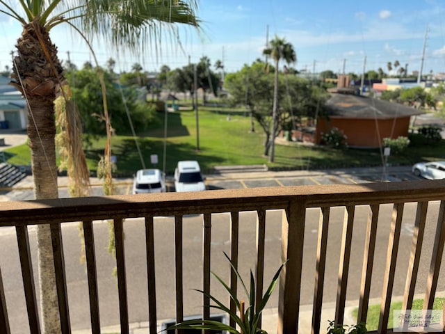 view of yard with a balcony