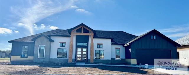 view of front facade featuring a garage and board and batten siding