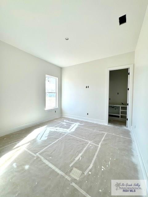 empty room with baseboards