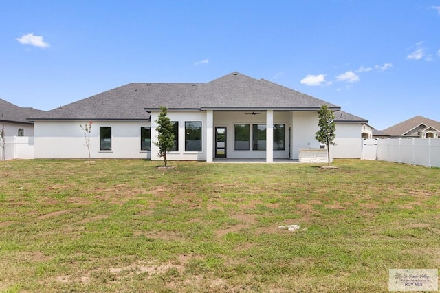 1305 Thacker Ln, Harlingen, TX 78552 - rear view of house featuring stucco siding, ceiling fan, a patio area, and roof with shingles