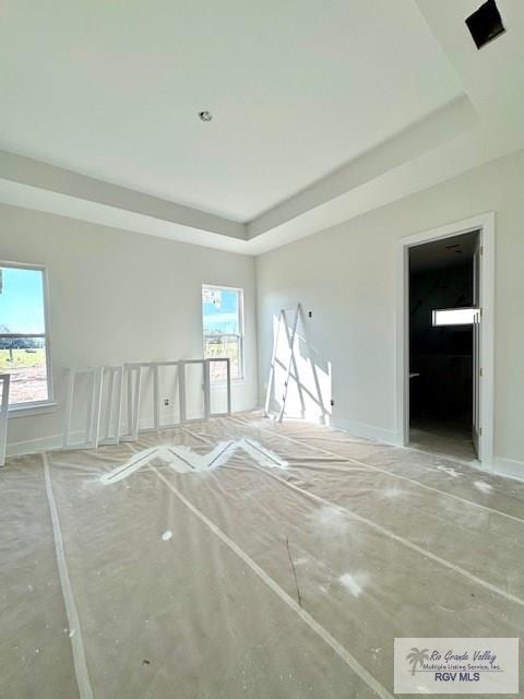 spare room featuring a tray ceiling