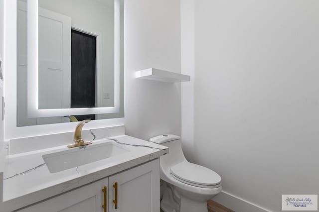1305 Thacker Ln, Harlingen, TX 78552 - half bath featuring vanity and toilet