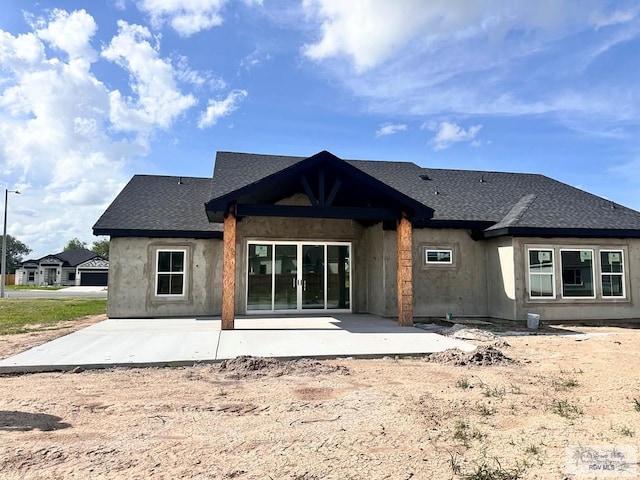 2625 Marky St, Harlingen, TX 78552 - rear view of house with a patio area and a shingled roof
