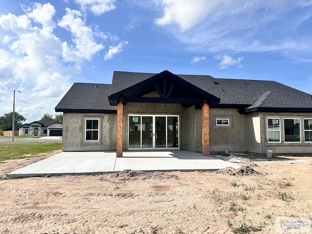 2625 Marky St, Harlingen, TX 78552 - back of house with a patio and roof with shingles