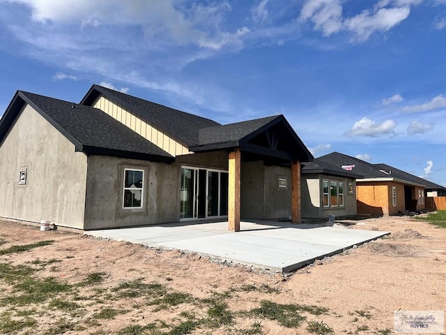 2625 Marky St, Harlingen, TX 78552 - rear view of house with a patio area and a shingled roof