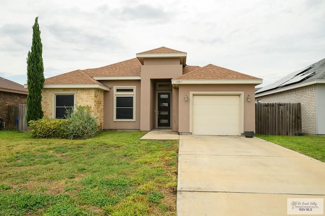 23314 Grapefruit Ave, Harlingen, TX 78552 - view of front of home featuring an attached garage, stucco siding, driveway, and a shingled roof