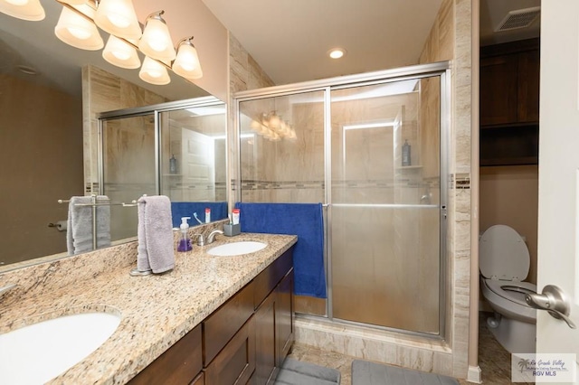 23314 Grapefruit Ave, Harlingen, TX 78552 - full bath with double vanity, a stall shower, a chandelier, and recessed lighting