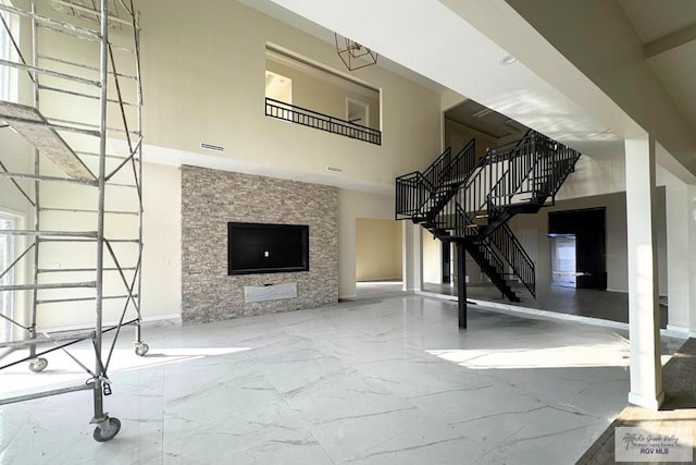 unfurnished living room with a fireplace