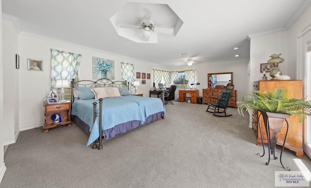 carpeted bedroom featuring crown molding, a ceiling fan, and baseboards