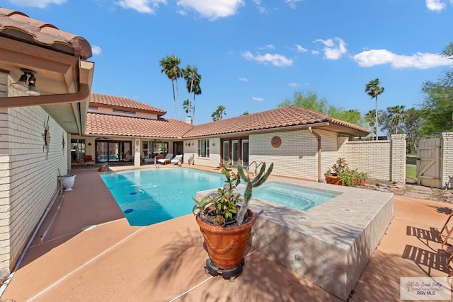 view of pool featuring french doors, a patio, a fenced in pool, and fence