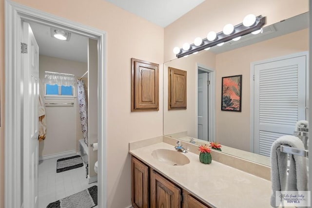 bathroom with shower / bathtub combination with curtain, toilet, and vanity