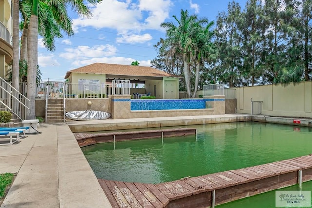 view of swimming pool with a patio area