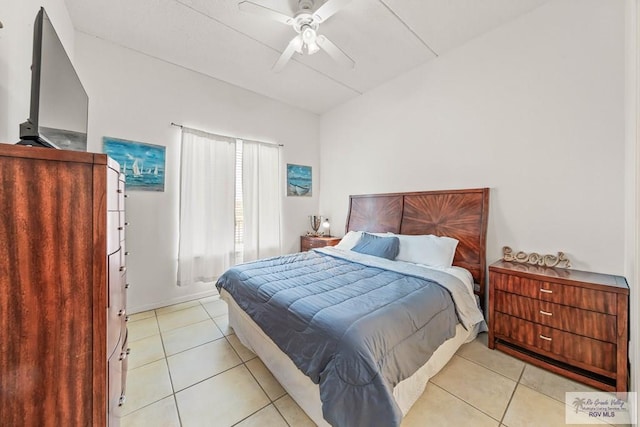 bedroom with light tile patterned floors and ceiling fan