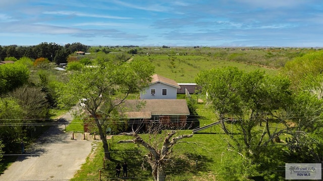 birds eye view of property with a rural view