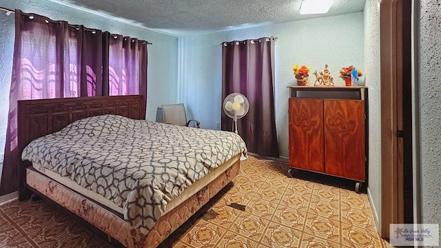 bedroom featuring a textured ceiling