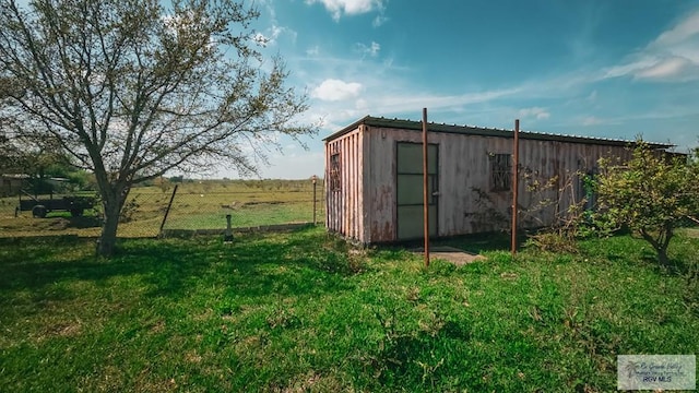 4425 S Oklahoma Ave, Brownsville, TX 78520 - view of outdoor structure featuring an outbuilding and fence