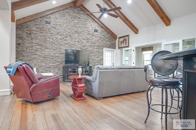 living room featuring ceiling fan, beam ceiling, high vaulted ceiling, and light hardwood / wood-style flooring