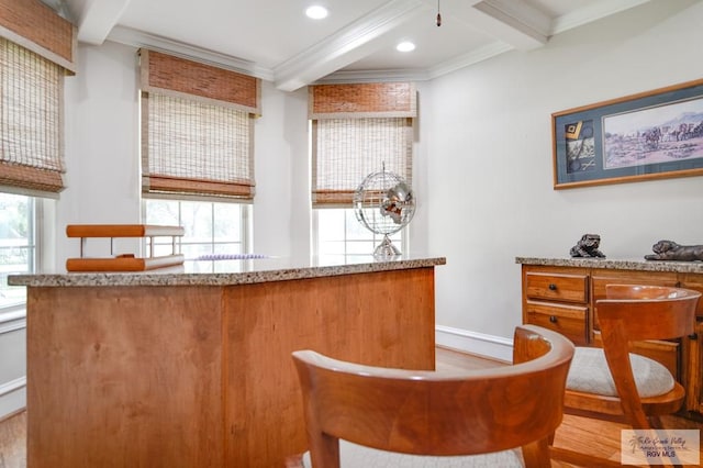 bar featuring beam ceiling, crown molding, light stone counters, and light wood-type flooring