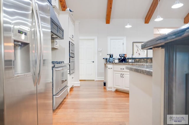 kitchen with appliances with stainless steel finishes, beam ceiling, light hardwood / wood-style flooring, white cabinetry, and hanging light fixtures