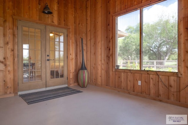 view of exterior entry featuring french doors