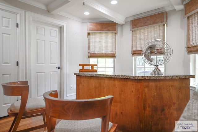 bar featuring beamed ceiling, wood-type flooring, and crown molding