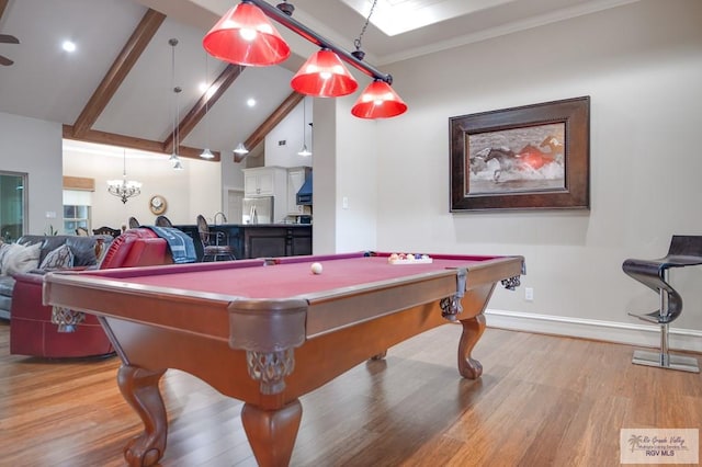 playroom with high vaulted ceiling, crown molding, light wood-type flooring, beam ceiling, and a chandelier