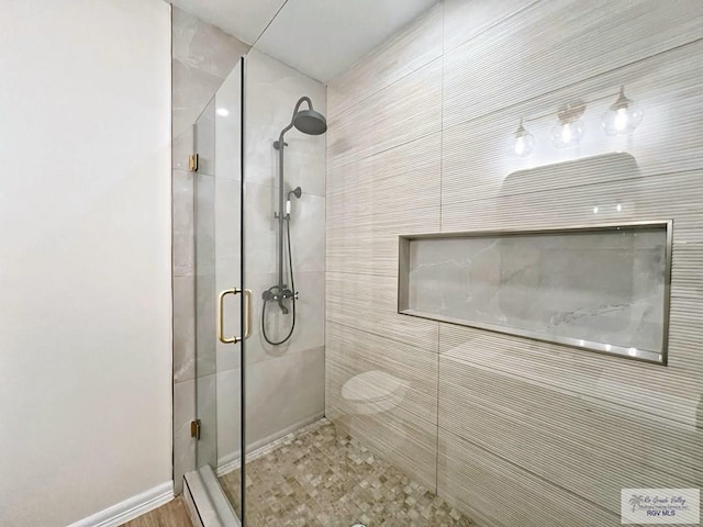 bathroom featuring a shower stall