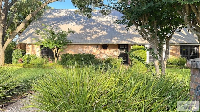 609 E Palm Valley Dr Unit 15, Harlingen, TX 78552 - view of property exterior featuring brick siding