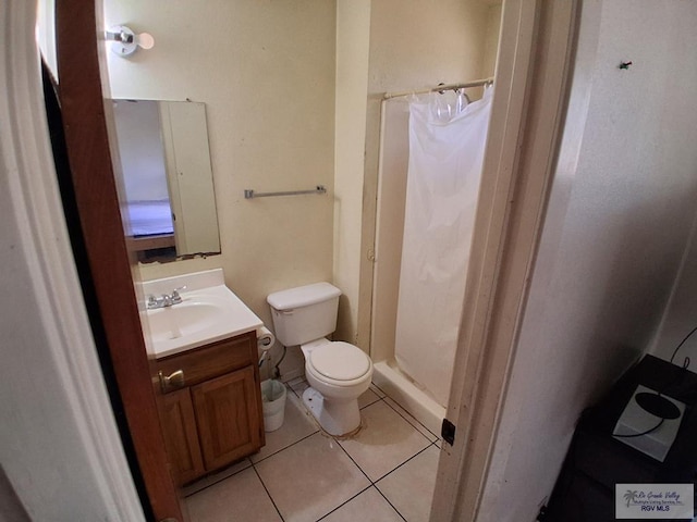 535 Windwood Way, Brownsville, TX 78526 - full bath with tile patterned floors, vanity, and a stall shower