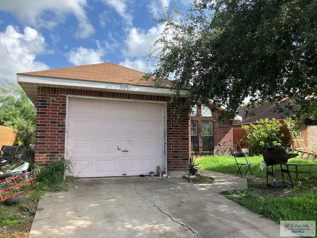 535 Windwood Way, Brownsville, TX 78526 - garage featuring concrete driveway