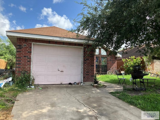 535 Windwood Way, Brownsville, TX 78526 - garage featuring driveway